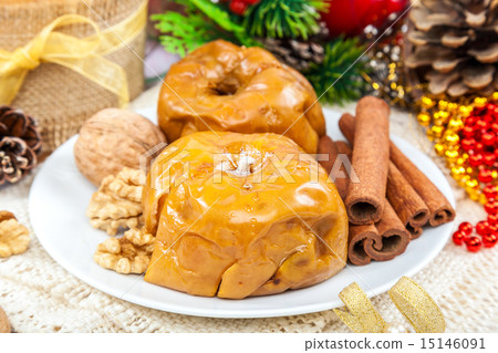 Baked apples with nuts and cinnamon. Baked apples with nuts and cinnamon. 15146091