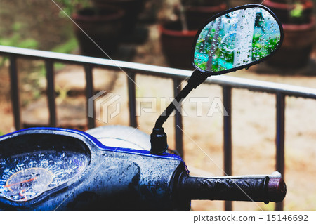 Tropical rain. Mirror of motorbike. 15146692