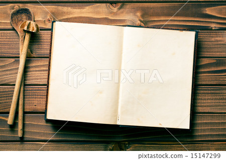 recipe book with stirring spoons 15147299