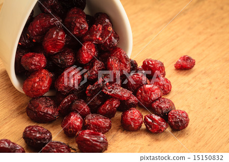 Dried cranberry fruit in bowl on table. Dried cranberry fruit in bowl on table. 15150832