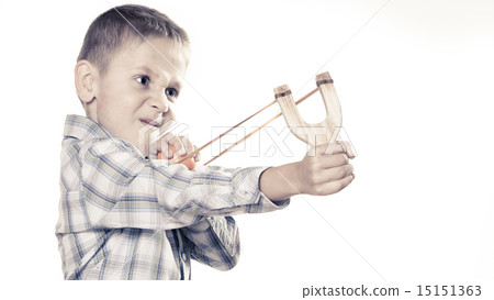 Kid holding slingshot in hands 15151363