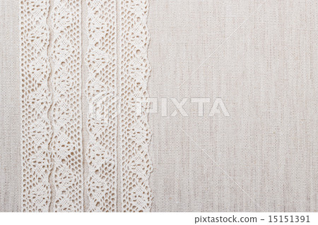 Lace ribbon on linen cloth background Lace ribbon on linen cloth background 15151391