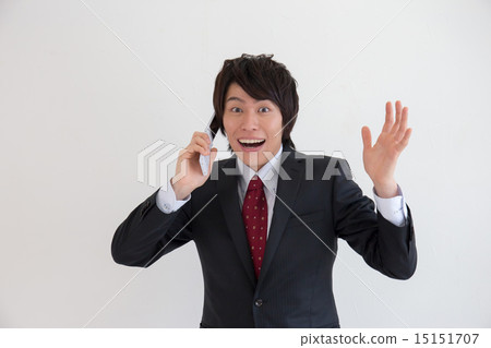 A man rejoicing during phone calls A man rejoicing during phone calls 15151707