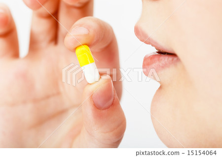 woman takes pill woman takes pill 15154064