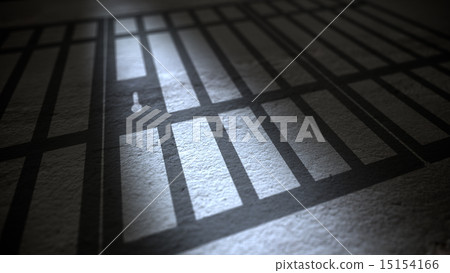 Jail cells bars casting shadows on floor. 15154166
