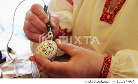 Man paints the Easter Egg Man paints the Easter Egg 15154464