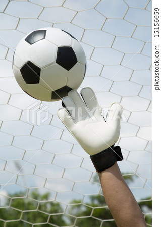 Goalkeeper used hands for catches the ball Goalkeeper used hands for catches the ball 15156659