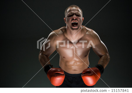 Muscular man screaming and roar Muscular man screaming and roar 15157841