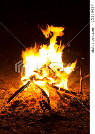 Flames of a campfire in the night.  15159487