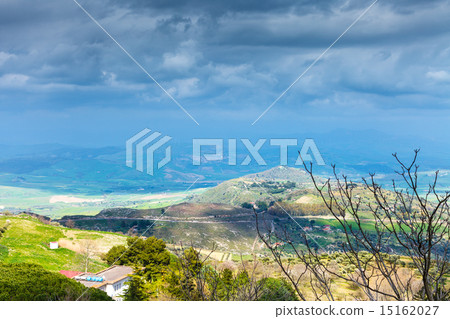 rainy clouds over green sicilian hills in spring 15162027