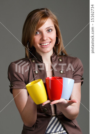 girl holding a colorful cups girl holding a colorful cups 15162734