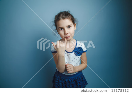 a girl of seven European appearance brunette licks a finger on a a girl of seven European appearance brunette licks a finger on a 15178512
