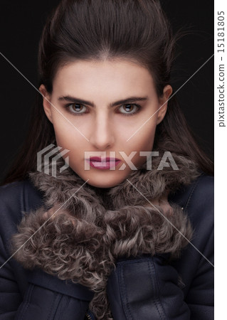 young brunette woman studio portrait in fur 15181805