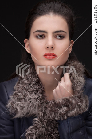 young brunette woman studio portrait in fur 15181806
