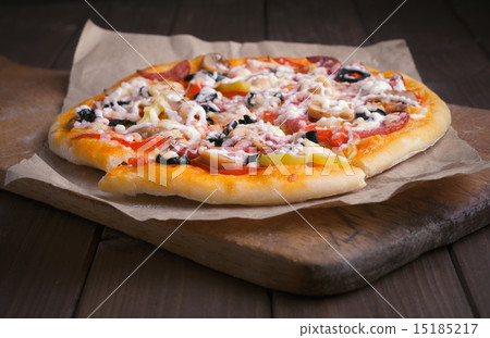 Pizza on cutting board 15185217