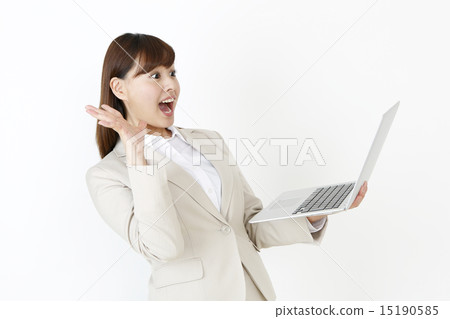 A woman surprised with a notebook A woman surprised with a notebook 15190585