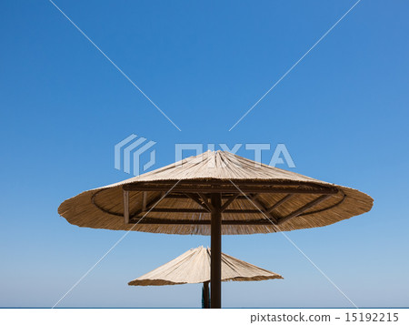 Two parasols made of straw 15192215