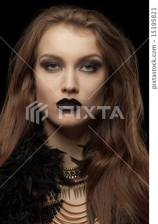 Closeup portrait of a gothic femme fatale with black lips 15195821