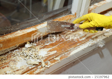Old window restoration, worker remove paint Old window restoration, worker remove paint 15197962