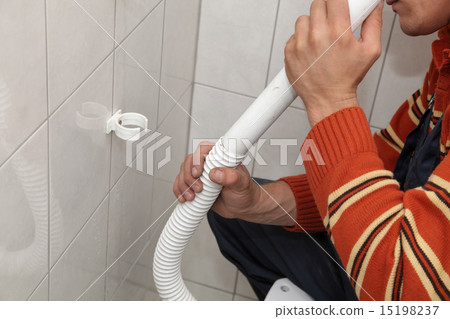 Plumber fixing plastic tube 15198237