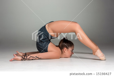 teenager doing gymnastics exercises teenager doing gymnastics exercises 15198427