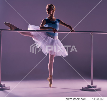 classic ballerina posing at ballet barre classic ballerina posing at ballet barre 15198468