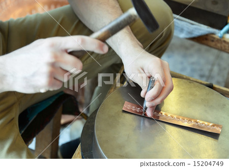 Craftsman makes copper bracelet 15204749