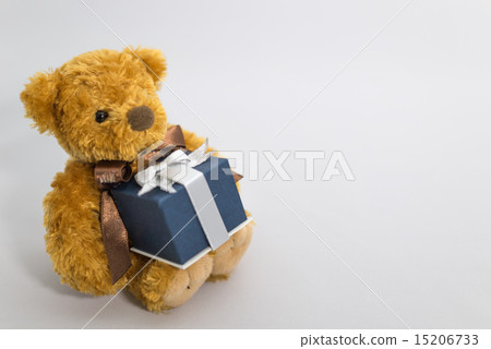 Plush toy of a bear with a present 15206733