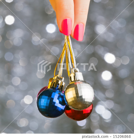 Ð¡hristmas disco balls on beautiful grey bokeh background. Woman 15206868