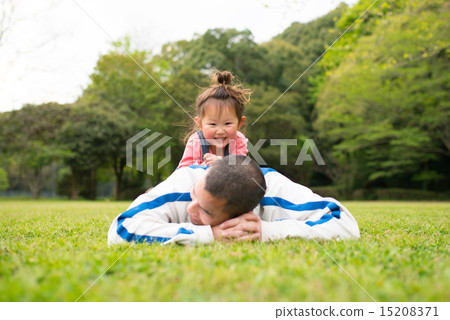 Parent and child playing in the park Parent and child playing in the park 15208371