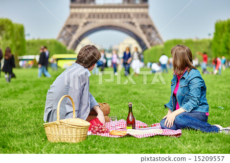 Couple having a picnic near the Eiffel tower Couple having a picnic near the Eiffel tower 15209557
