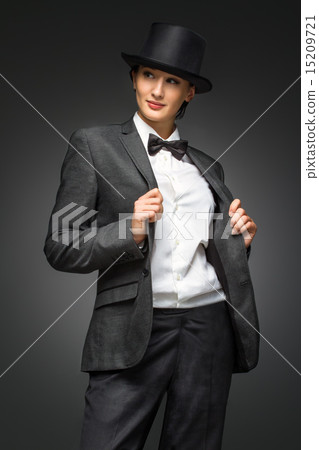 Young retro style business woman standing against grey backgroun Young retro style business woman standing against grey backgroun 15209721