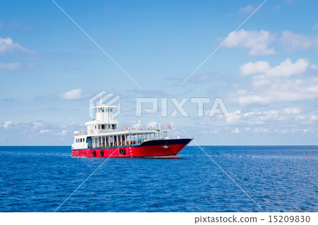 Passenger ferry boat in open waters over against blue sky 15209830