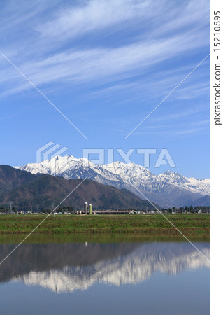 Northern Alps of spring desired from the foot of the mountain 15210895