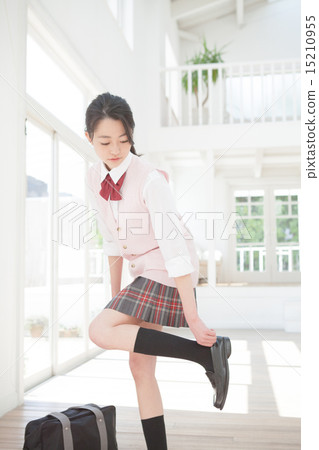 put on (or wear) footwear, wear, high school girl 15210955