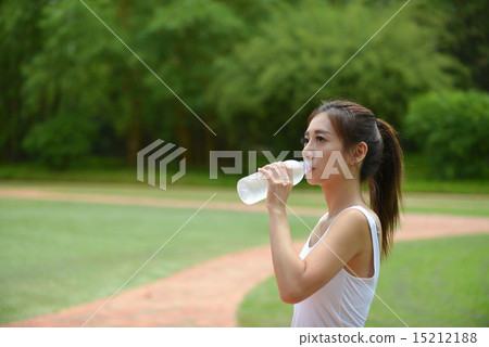 Sport girl exercise and jogging in the green park. 15212188