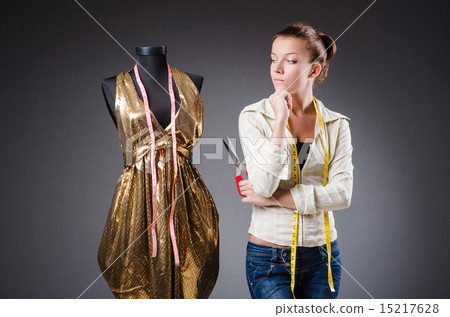 Woman tailor working on clothing Woman tailor working on clothing 15217628