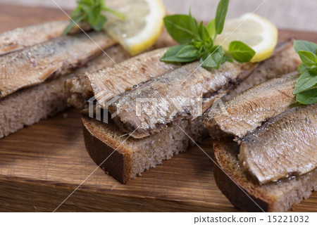 sprats lying on pumpernickel bread sprats lying on pumpernickel bread 15221032