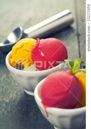 Two Ice cream scoops in bowls with wafer 15221958