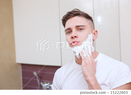 Young handsome man shaving Young handsome man shaving 15222603
