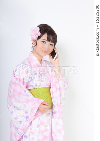 A woman in a yukata robe calling 15225200