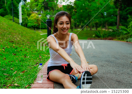 Girl working out in the singapore park Girl working out in the singapore park 15225300