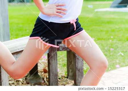 Girl working out in the singapore park Girl working out in the singapore park 15225317