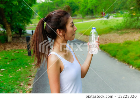 Girl working out in the singapore park Girl working out in the singapore park 15225320