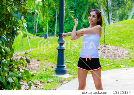 Girl working out in the singapore park Girl working out in the singapore park 15225324