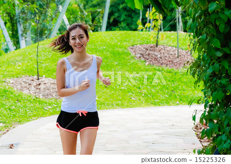 Girl working out in the singapore park Girl working out in the singapore park 15225326