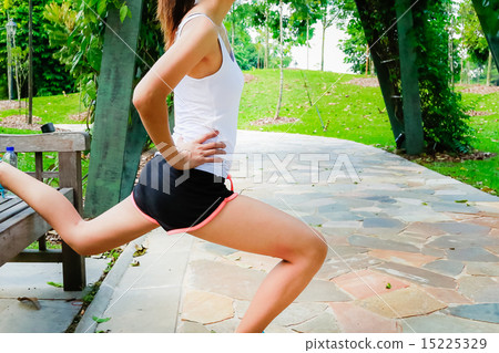 Girl working out in the singapore park  15225329