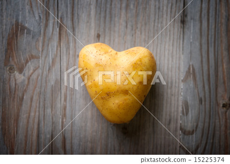 Heart shaped golden potato 15225374