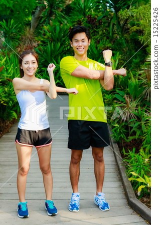 Couple Working out in the Singapore Park Couple Working out in the Singapore Park 15225426