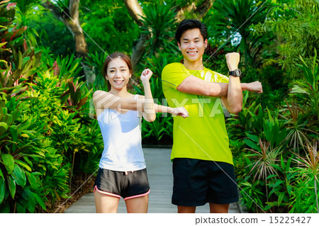 Couple Working out in the Singapore Park Couple Working out in the Singapore Park 15225427